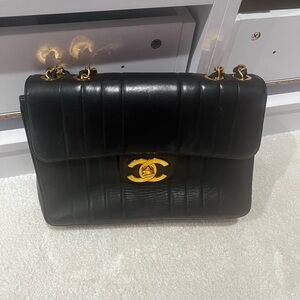 Pre-loved Chanel Black Lambskin Leather Vertical
Jumbo Flap.